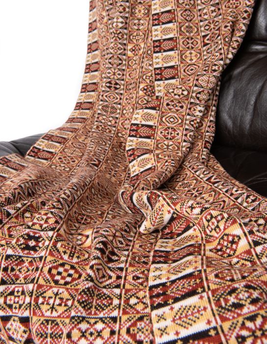 Heritage throw in checkerboard of colours and Fair Isle patterns with trees around edges